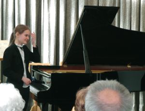 1156th Liszt Evening, Music and Literature Club in Wroclaw,19th April 2015. <br> Rozalia Kierc wondering what to play for the encore. Photo by  Elżbieta Mastalerz.